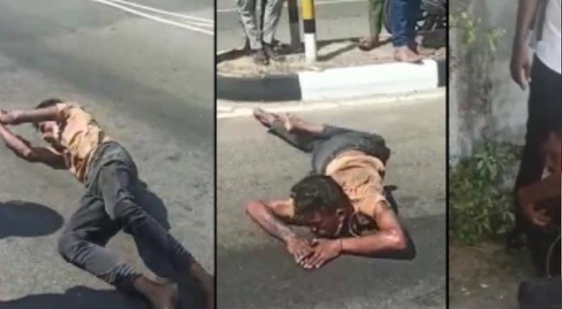 மட்டக்களப்பு நகரில் பாம்பு போல் ஊர்ந்து சென்ற இளைஞன் 
